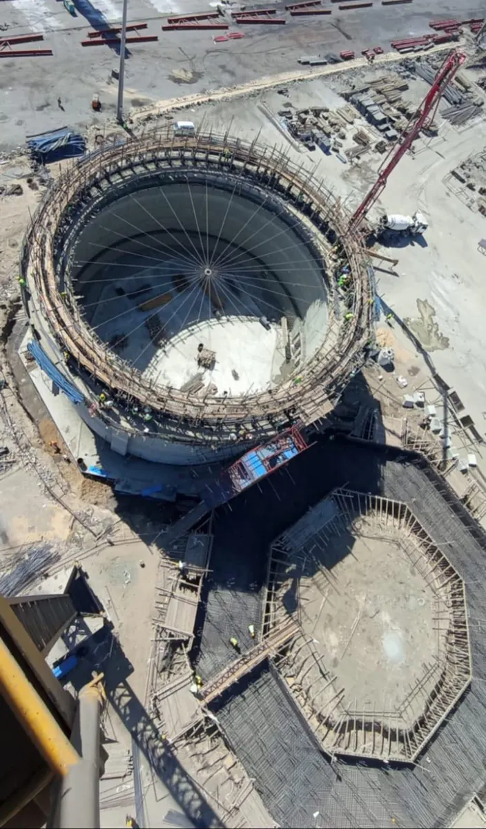 Aerial view of the completed silo shell with reinforcement and formwork for the adjacent silo foundation below