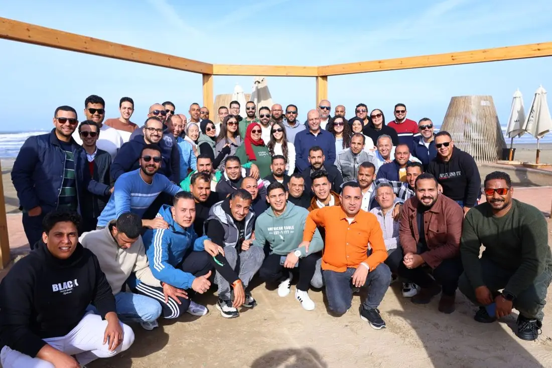 Team gathering at the beach
