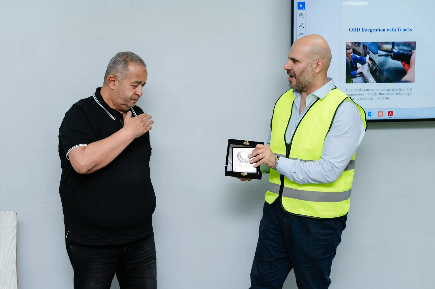 Sky Ports and AASTMT representatives exchanging a commemorative plaque