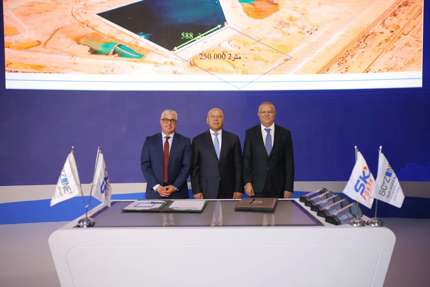 Sky Ports and SCZONE executives on stage following the agreement signing